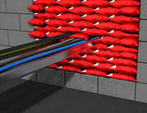 Almohadillas intumescentes sellando paso de cables en pared cortafuegos.